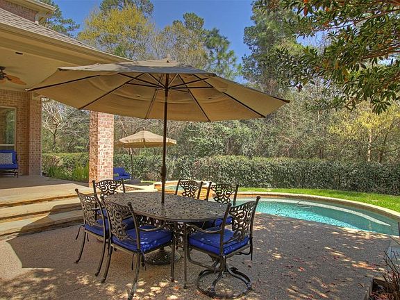 Tree-lined views, covered porch, extended decking and tiers create an ideal getaway anytime of year.