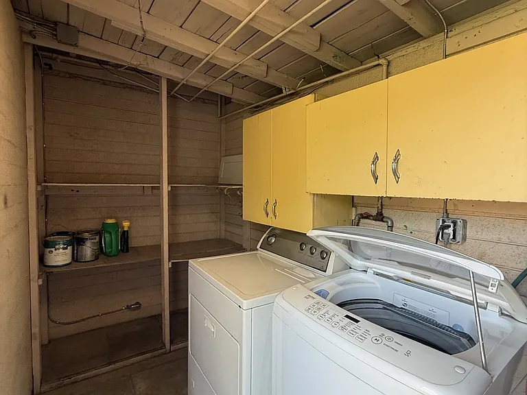Outdoor laundry room with storage shelving
