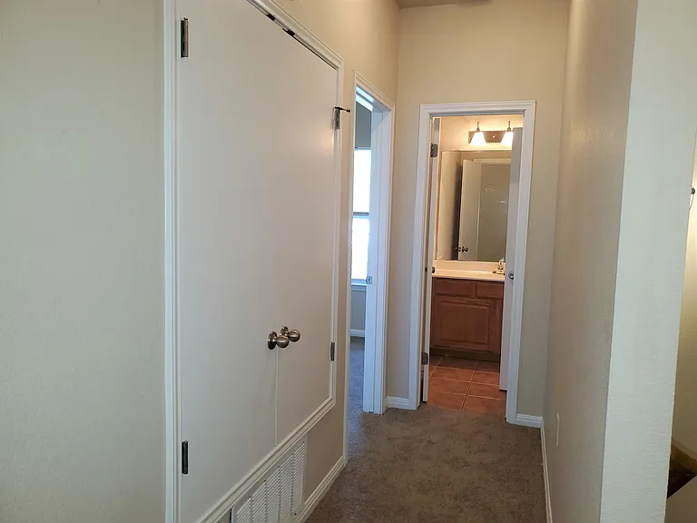 HALLWAY TO 2ND FULL BATHROOM & 1ST BEDROOM