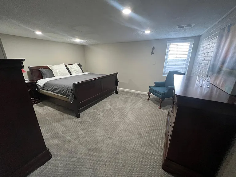 Master bedroom with a king sized memory foam mattress