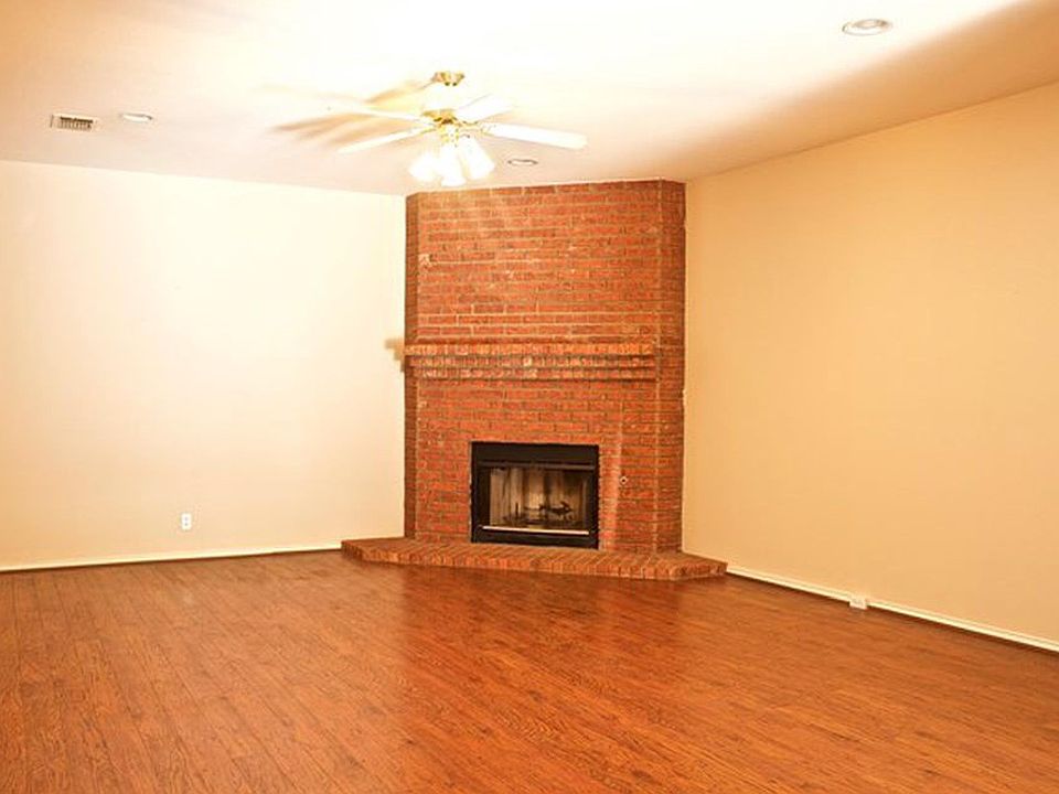Spacious living area with hardwood flooring
