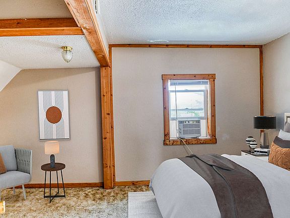 Bright, empty room with light-colored walls, a wooden accent.