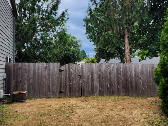 Side of home yard and AC unit