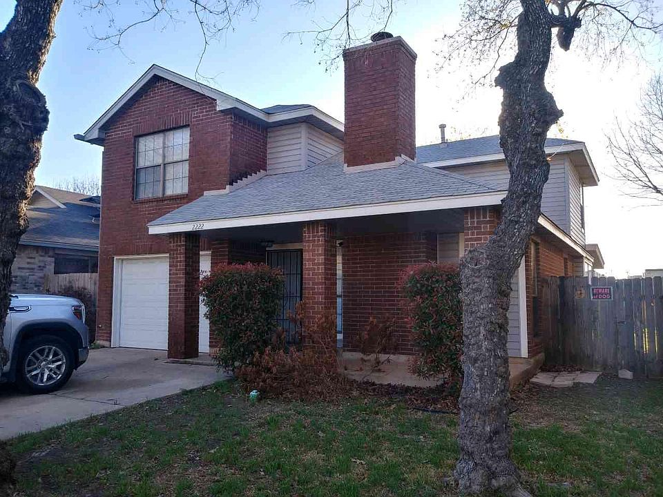 Front of the house with large driveway and off street parking
