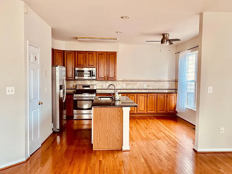 Kitchen with granite countertop and stainless steel appliances