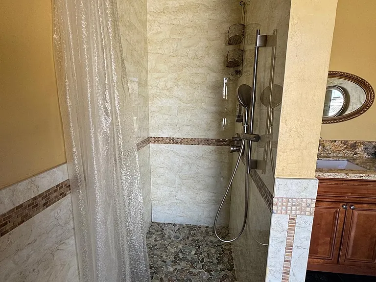 primary bathroom shower (includes luxury rainfall shower head)