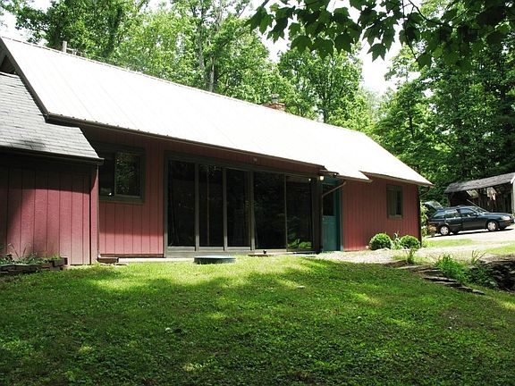 Large bank of windows in house living room.