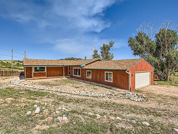 Lovely front of home with views in every direction. Lots of parking, paved access all the way to driveway!