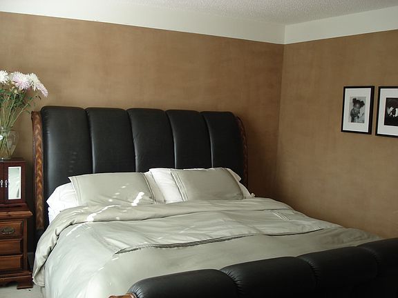 Elegant master bedroom with updated paint