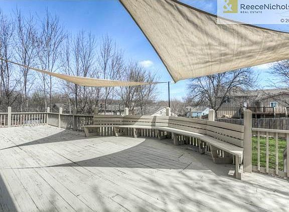 Beautiful deck with bench seating runs the length of the house.