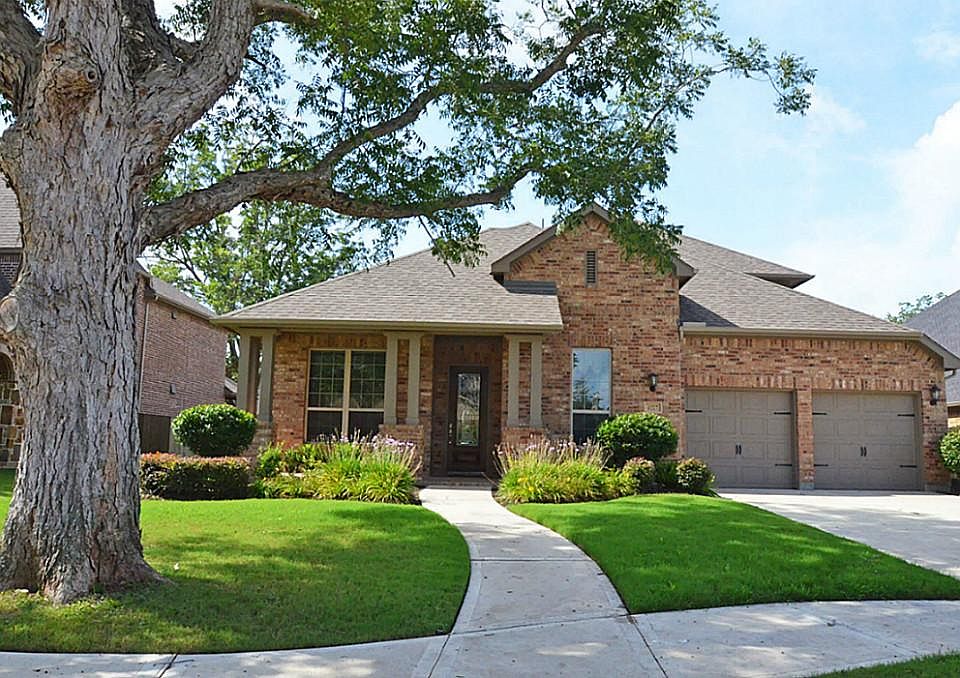Front of house with mature tree