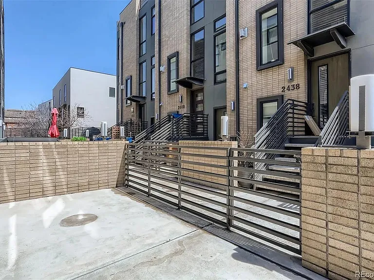 patio behind home off of kitchen - perfect for dining table and bbq