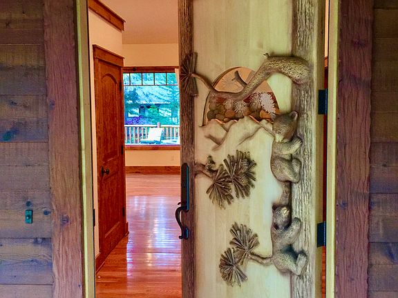 Welcome. Step through the bear cub carved door into the warm Great Room.