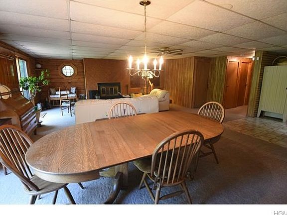 Dining room leads to upper level decking overlooking lake.