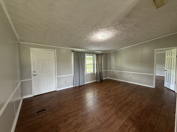 Living Area with view of primary bedroom entrance