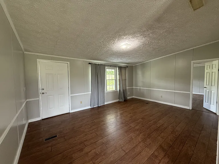 Living Area with view of primary bedroom entrance