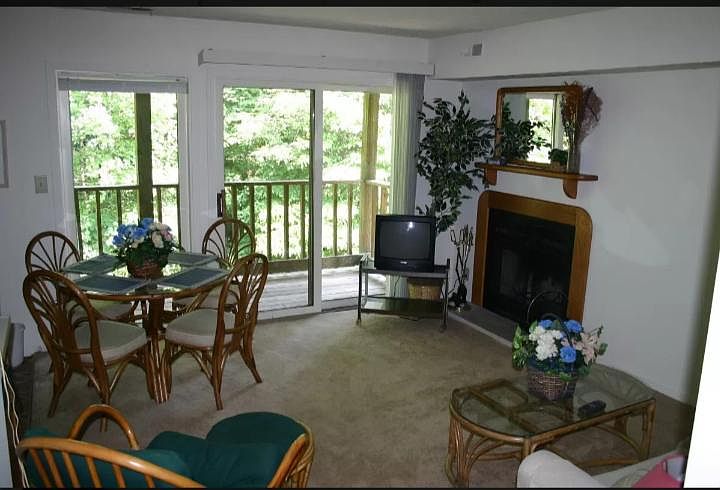 LIVING AREA. DECK/PATIO OVERLOOKING WOODS. FIREPLACE