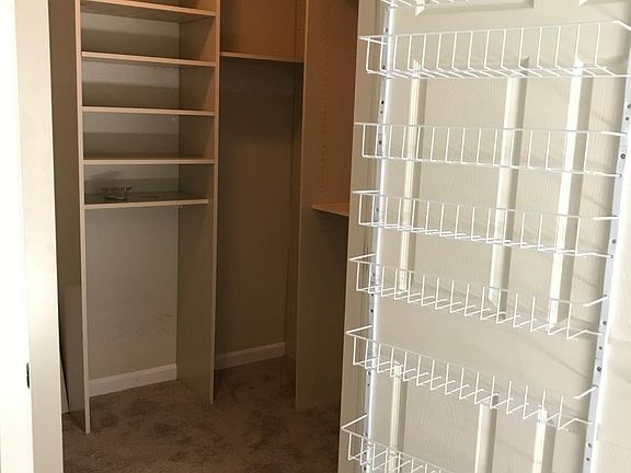 Both walk in closets with furniture