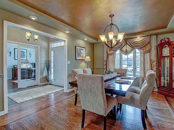 Dining Room features Hardwood Floors, Recessed Lighting and an Tray Ceiling! Stunning!!!