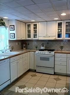 Custom Kitchen
						:
						Tile counters/floor, resessed lighting. Stove, refrig, dish washer, micro