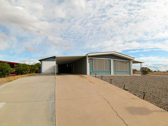 Main driveway of home and carport