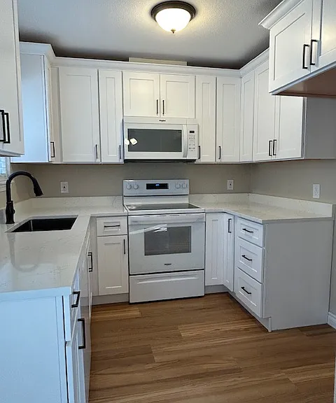 All new... never been used kitchen.
Cabinets, granite counter tops, appliances, fixtures, flooring ..... all of it.