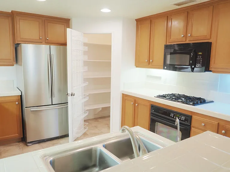 Walk-in pantry. Refrigerator included.