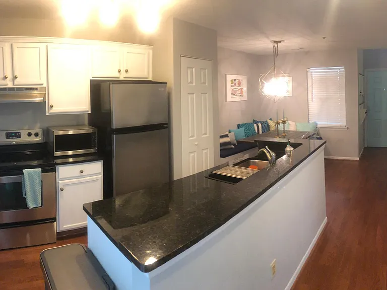 Kitchen with Oven, Microwave, Refrigerator, Dishwasher, & Double Sink with Garbage Disposal