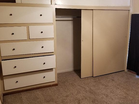 Closet & wall drawer unit in bedroom
