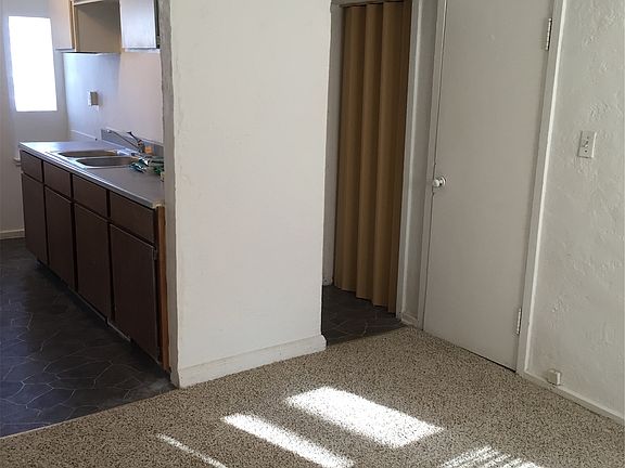 Right door is closet under stairs, passage on the right goes
