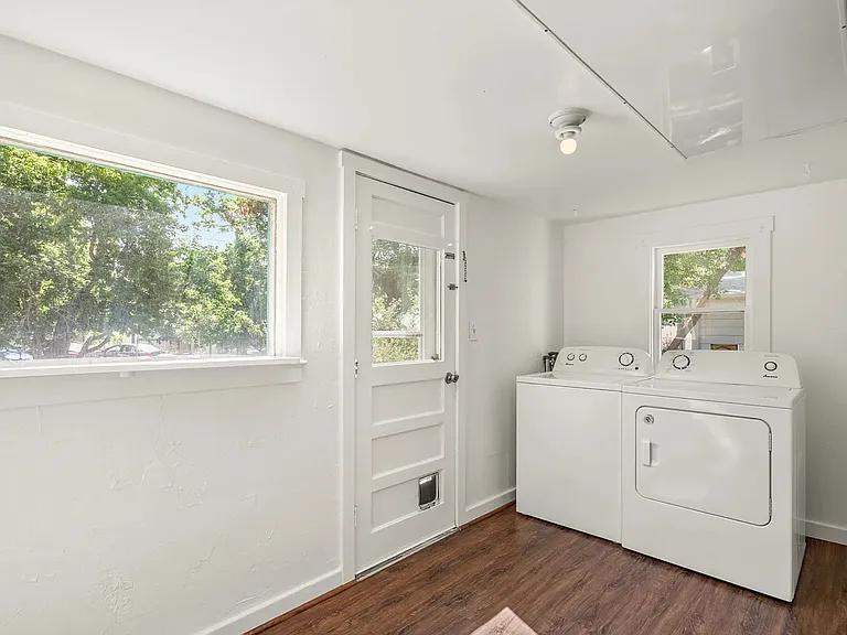 Laundry with in-unit washer and dryer with direct access to the back yard