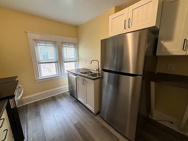 Kitchen, windows, dishwasher, sink, refrigrator, and above fridge cupboard.