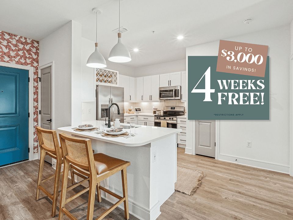 Kitchen with Quartz Countertop and Stainless Steel Appliances.