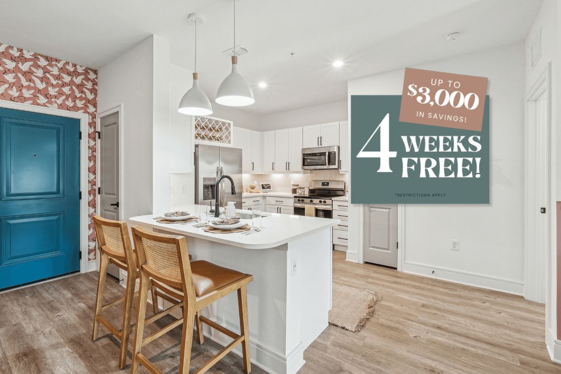 Kitchen with Quartz Countertop and Stainless Steel Appliances.