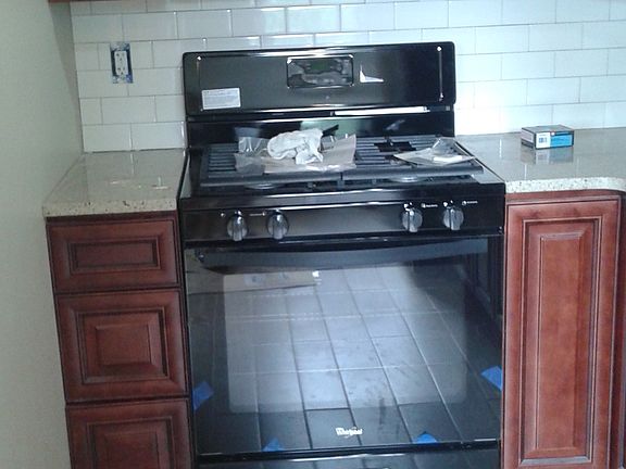 Gas range with microwave