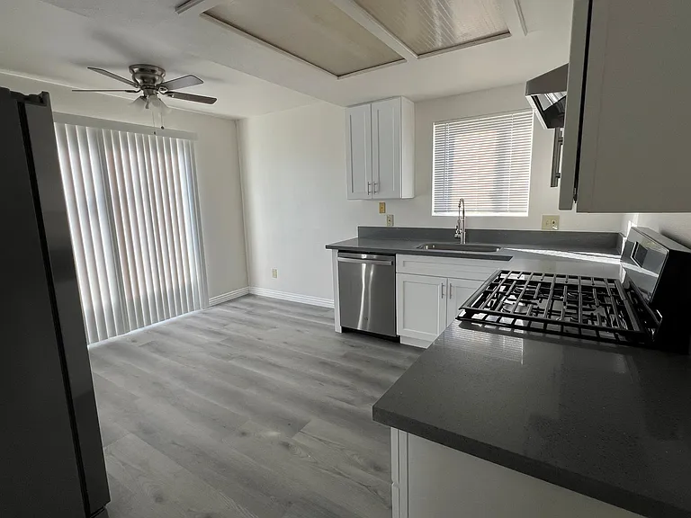 Patio doors leads to a balcony in the kitchen