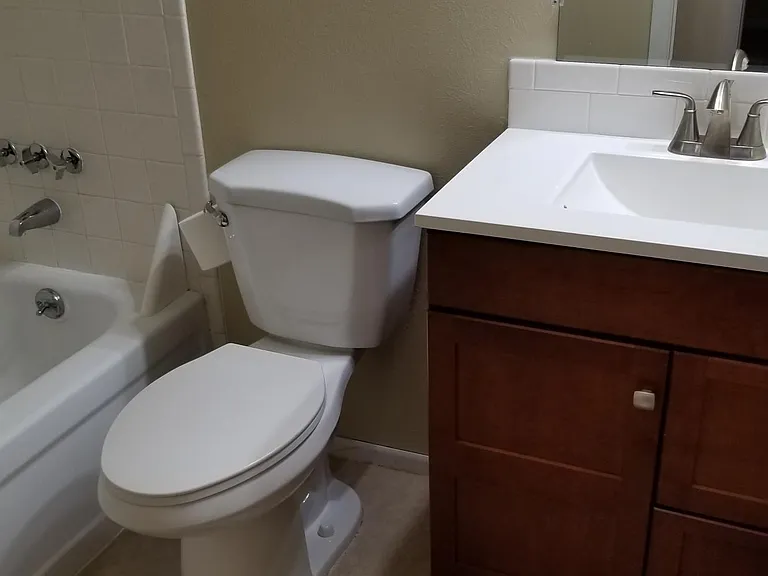 Hall bathroom with tub.