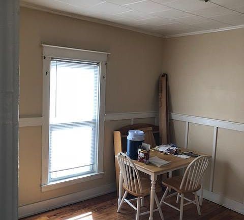 Bright and cheery dining Room with hardwood floors