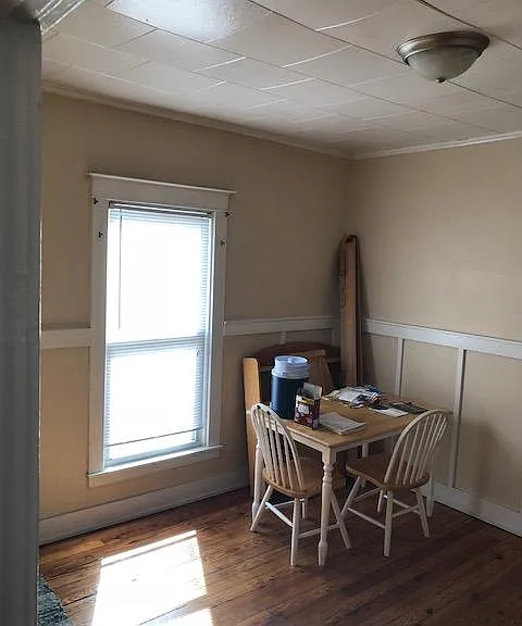 Bright and cheery dining Room with hardwood floors