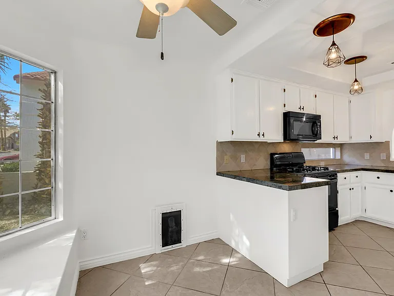 breakfast nook, dog door, kitchen