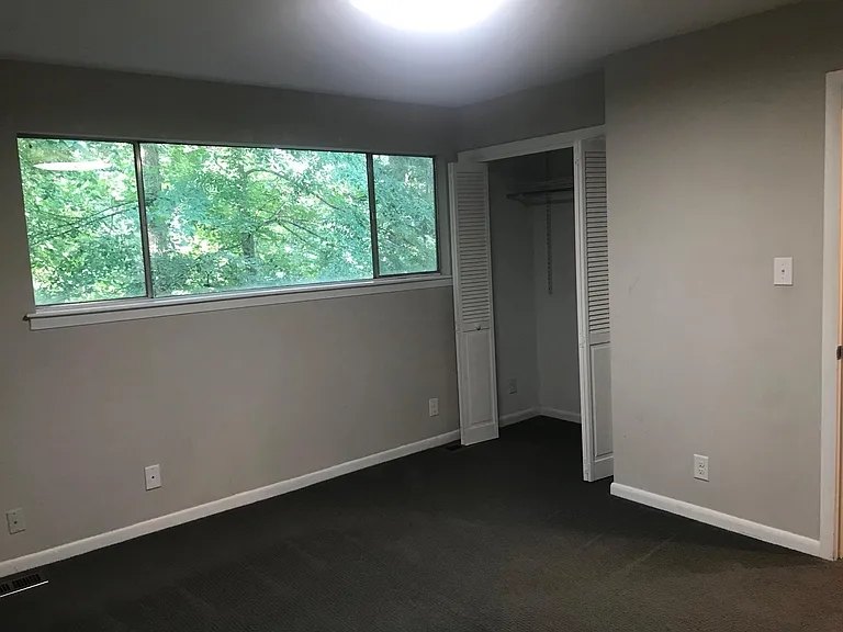 Second Bedroom with large double closet overlooking the forest in the rear.