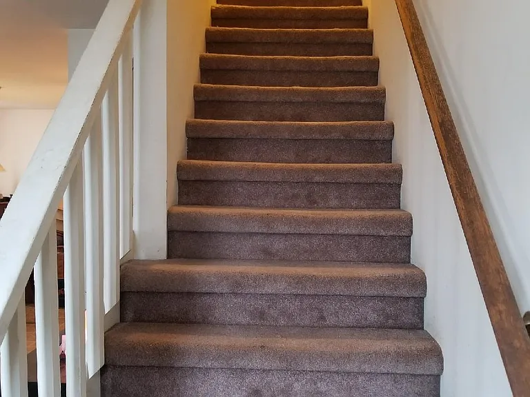 Stairs from main floor to upper level.