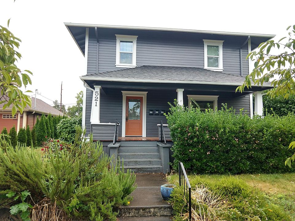 Front of the house, with covered porch, as well as fragrant rosemary and mint plants