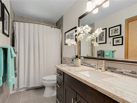 Exquisite and completely updated full bath on the main-level.