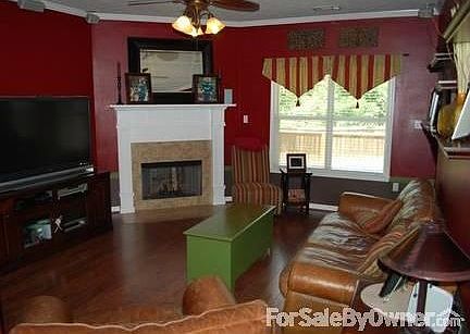 Spacious Livinng Room : Open floor plan from living room into formal dining area ,laminate flooring