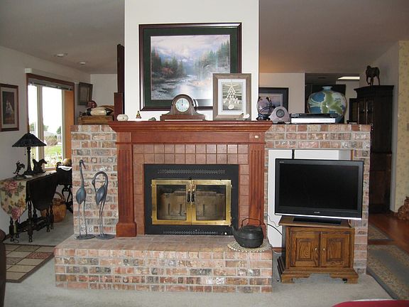Wood-burning fireplace with classic brick surround