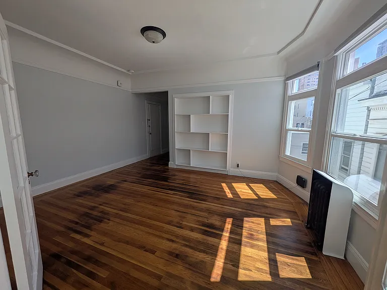 another view of the dining area, with wall of built-in shelves