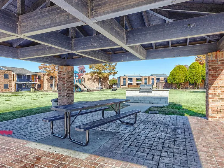 Enjoy outdoor gatherings in our shaded picnic area featuring a sturdy pavilion, picnic tables, and a beautiful courtyard view