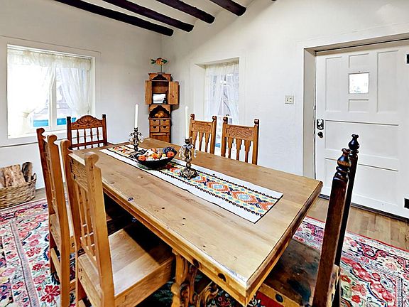 The charmed dining area offers seating for 6.