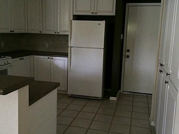 Large walk in kitchen with refrigerator